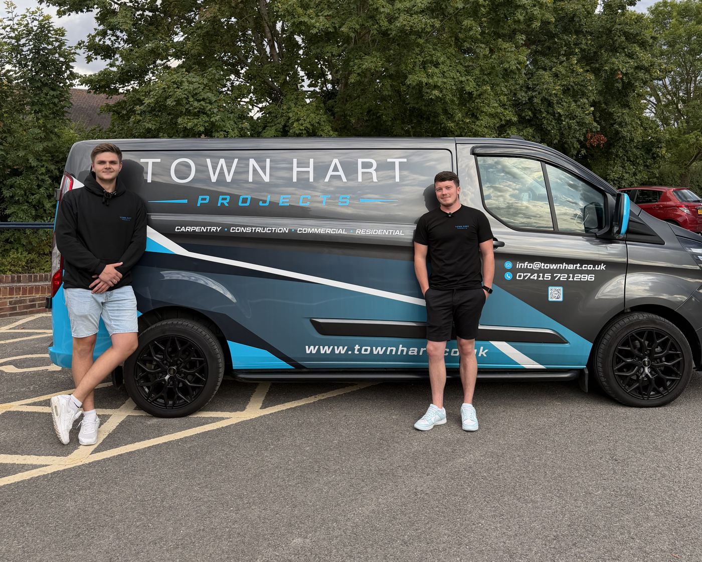 The Town Hart Projects team beside the wrapped company van